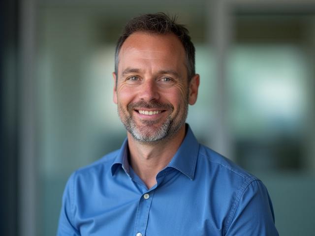 John Smith, founder of Top Spec Window Cleaning Ltd, smiling professionally.